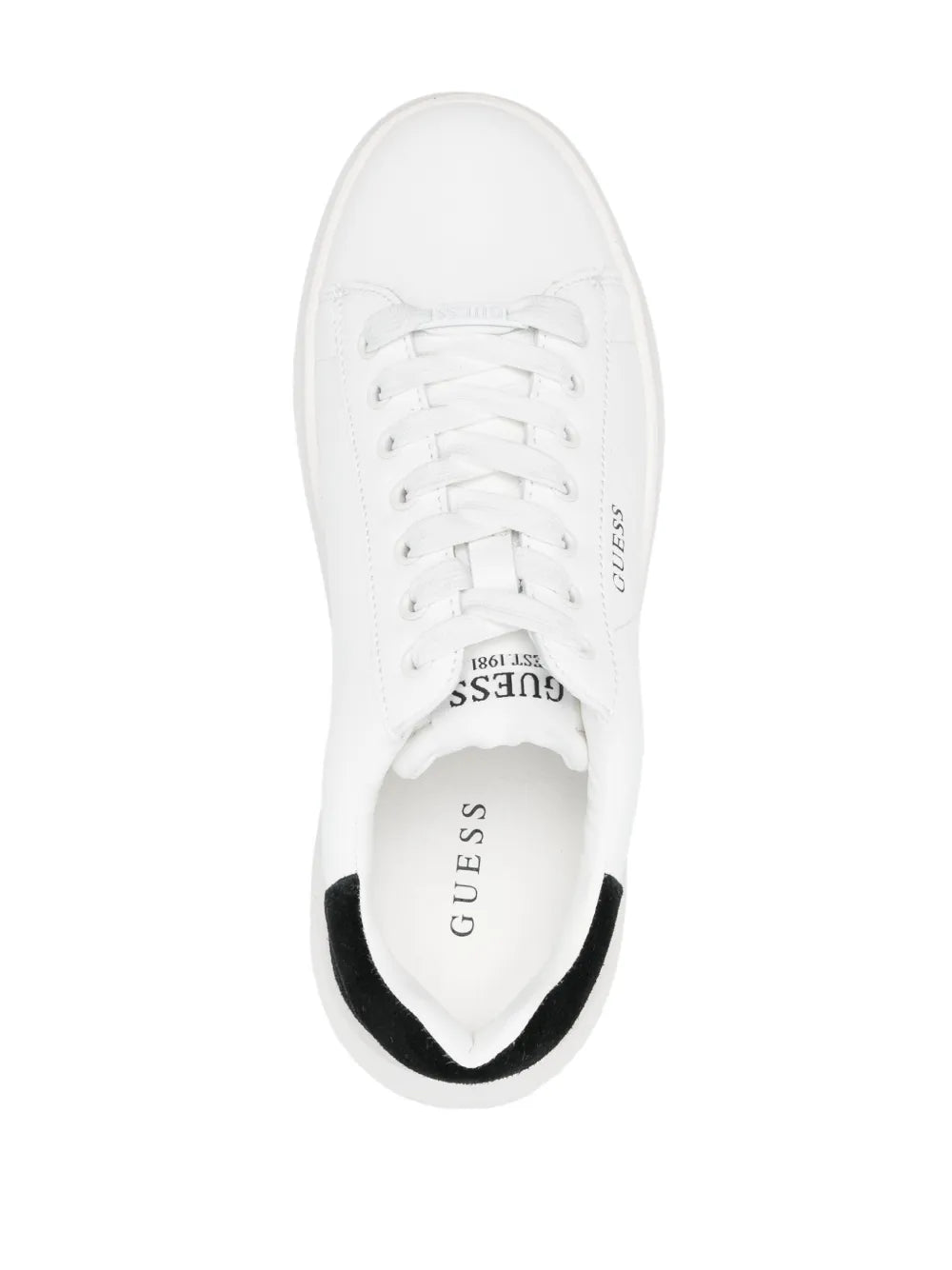 White sneaker interior view with white laces and GUESS text on tongue