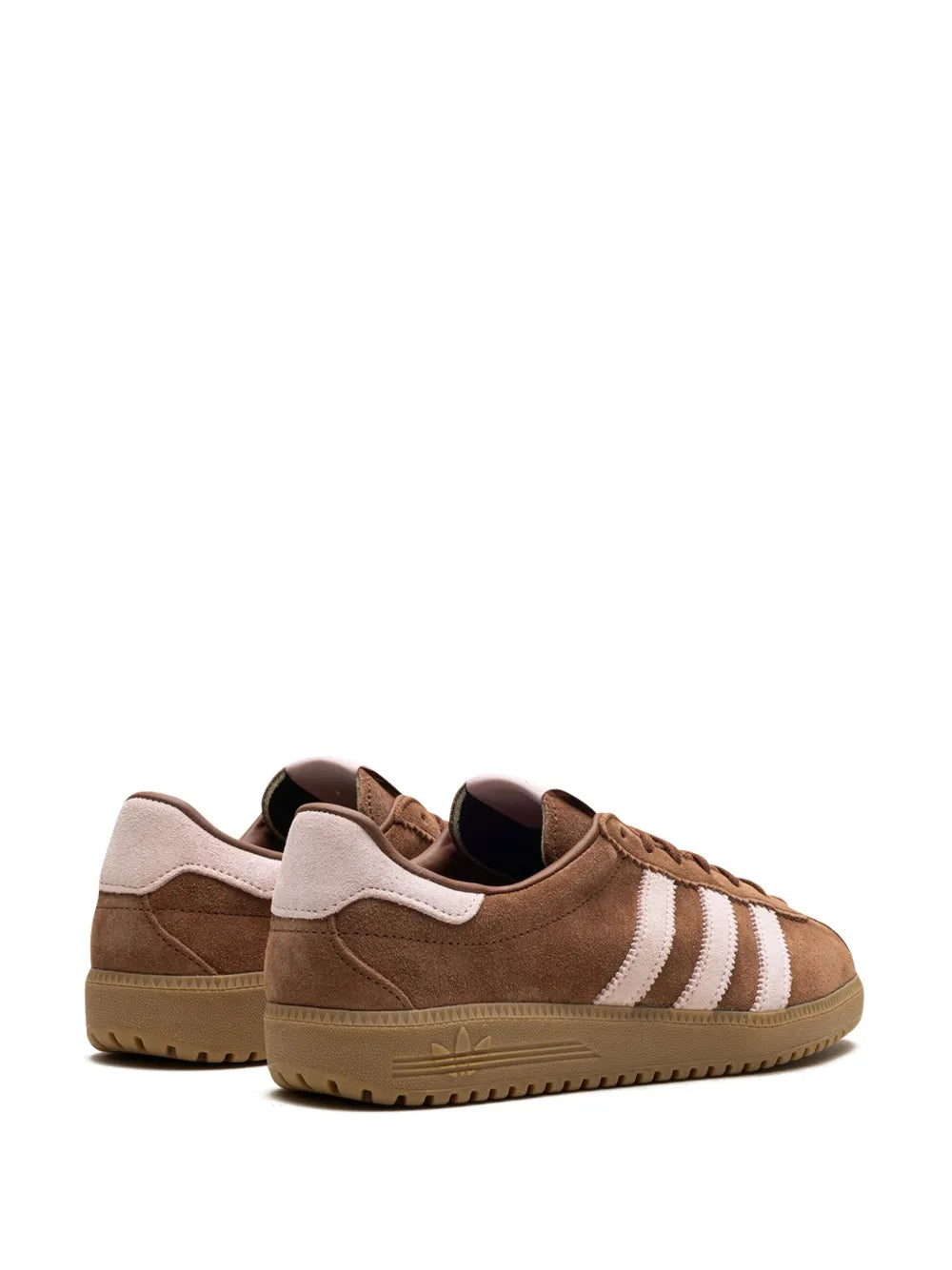 Brown low-top adidas sneakers with white stripes and padded collar