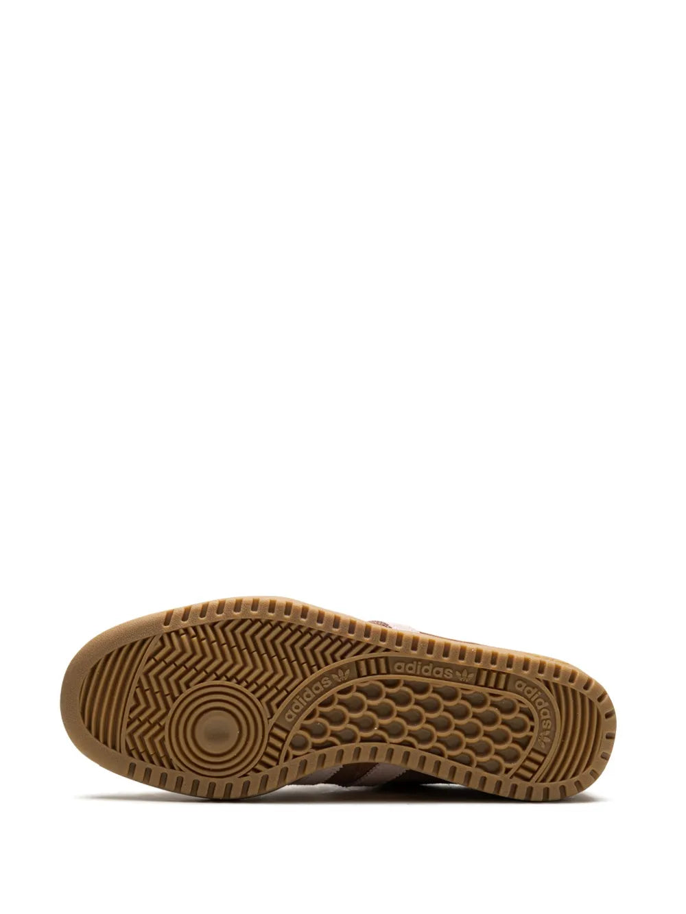 Brown adidas sneaker outsole with patterned tread and circular traction detail