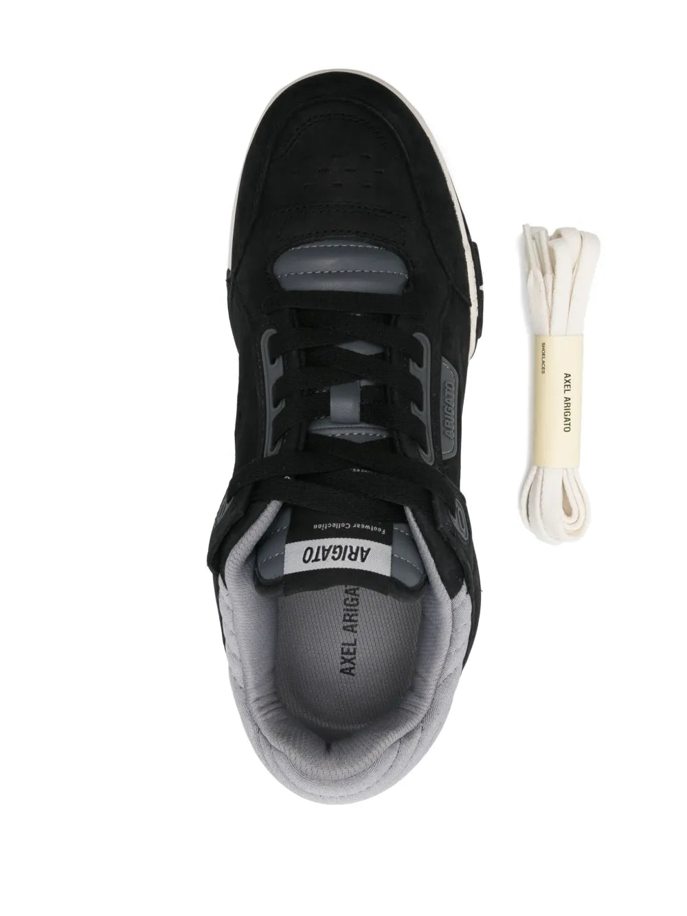Black low-top sneaker with lace-up front, gray lining, and extra lace pair