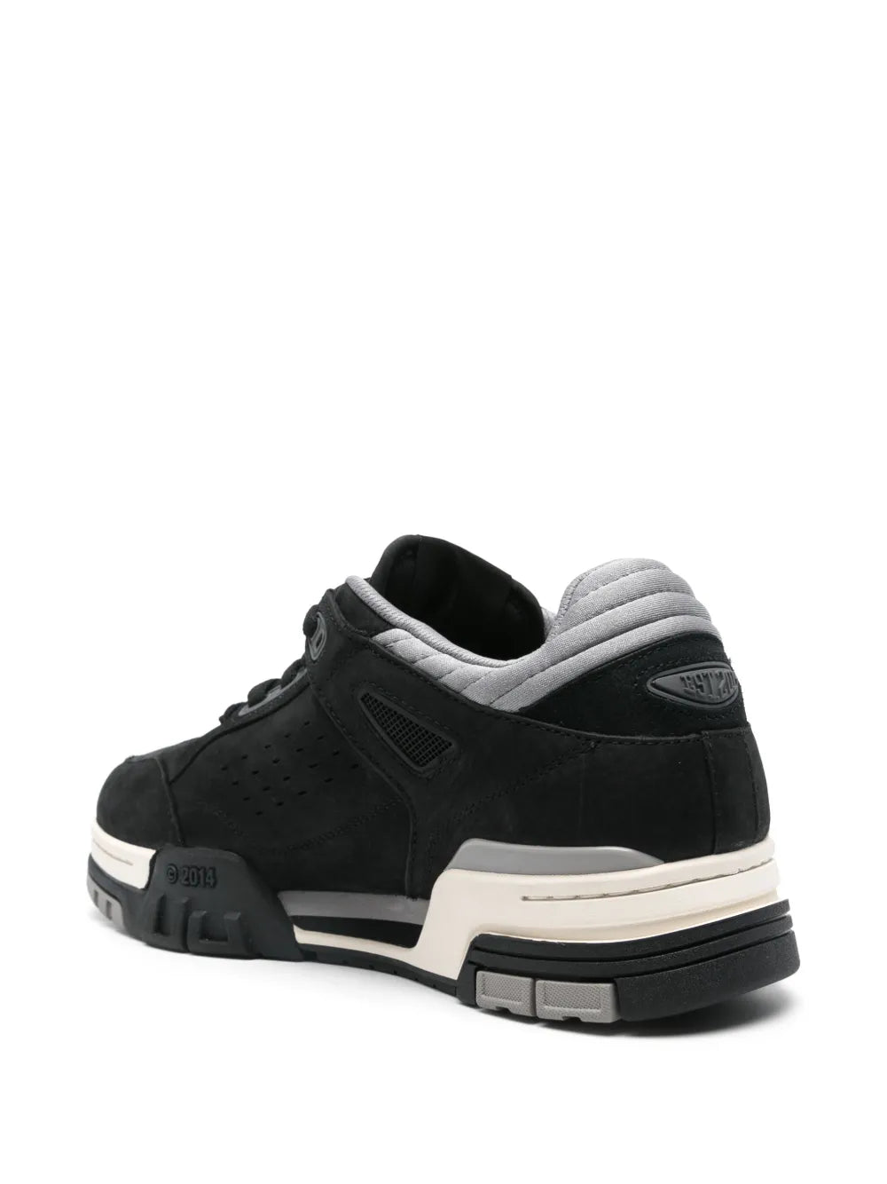 Black low-top sneakers with padded heel collar, off-white midsole, and treaded sole