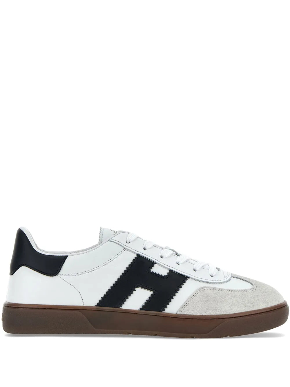 Low-top sneakers in white leather with black logo stripe and dark brown sole.