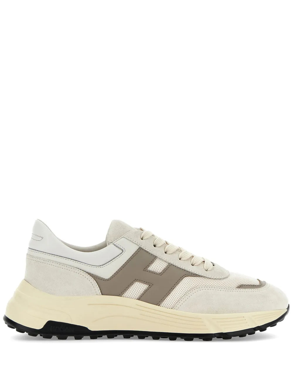 Beige lace-up low-top sneakers with rubber sole and side logo panels.