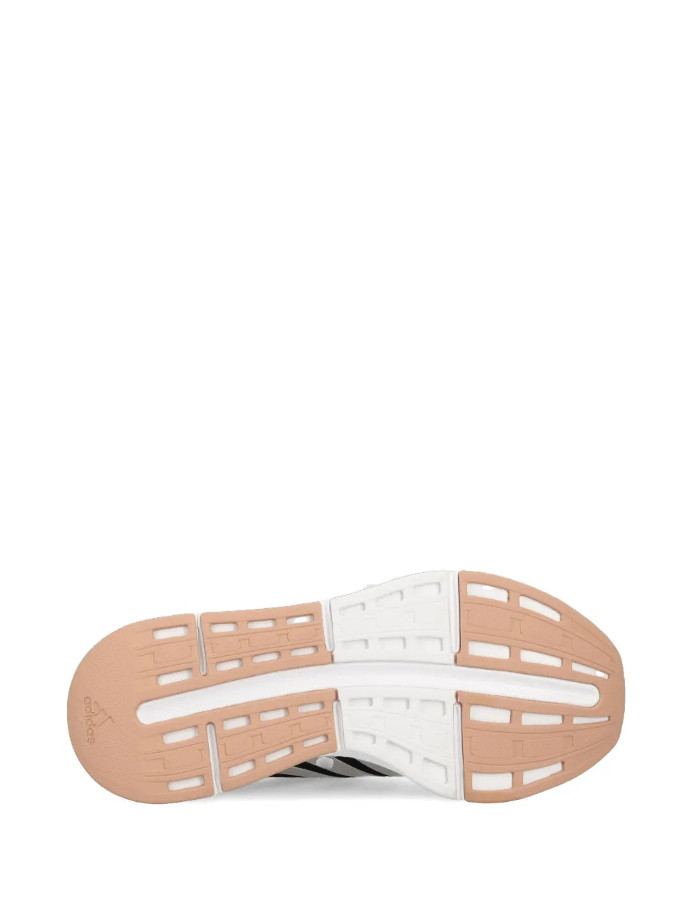 Shoe outsole with white traction pods and tan rubber base