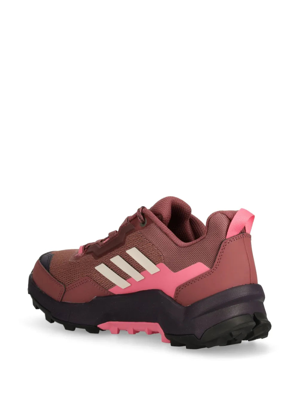 Trail shoes with dark brown upper, pink side panels, and high-traction outsole