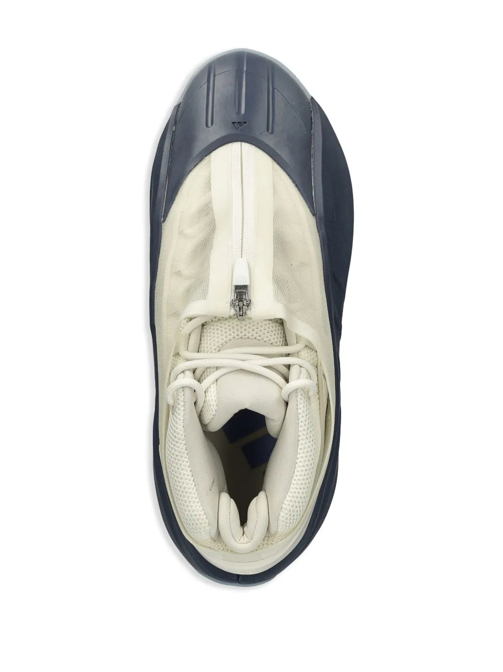 White and navy low-top sneaker from above, lace-up with zip at tongue
