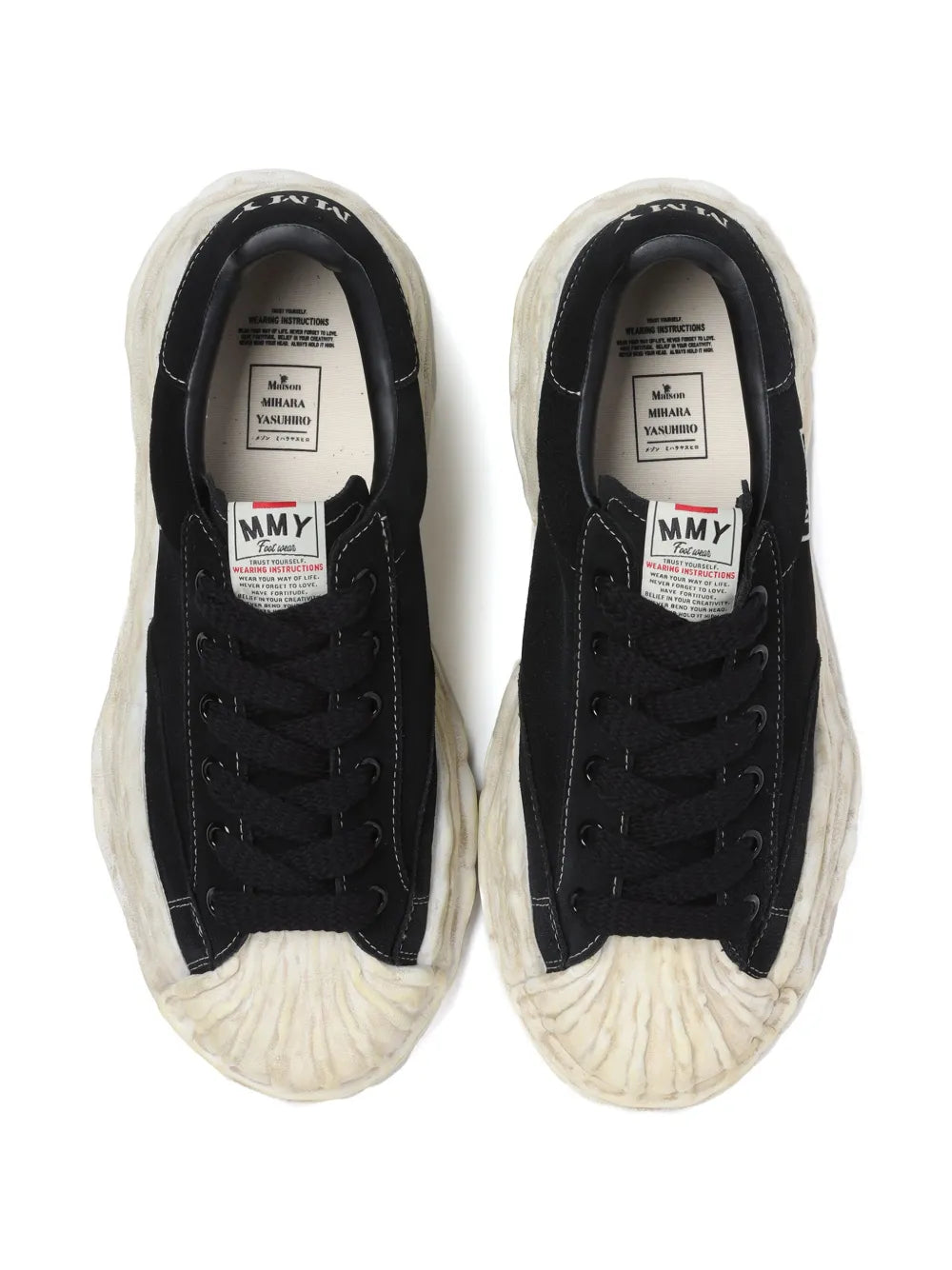 Black sneakers with cream cushioning detail and printed size label inside