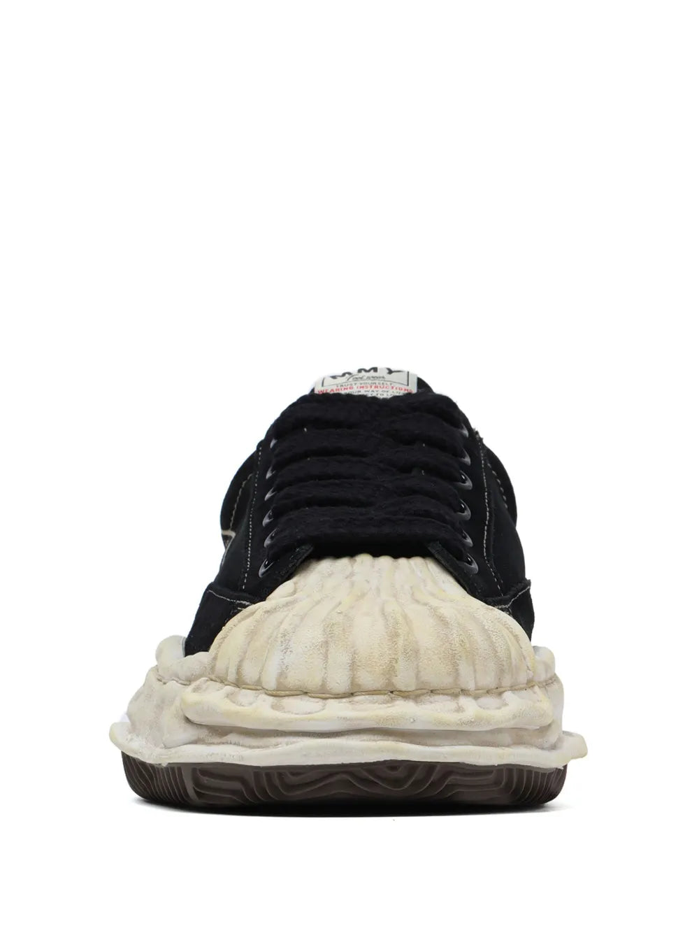 Black sneakers with padded collar, white sole, and stitched heel branding detail