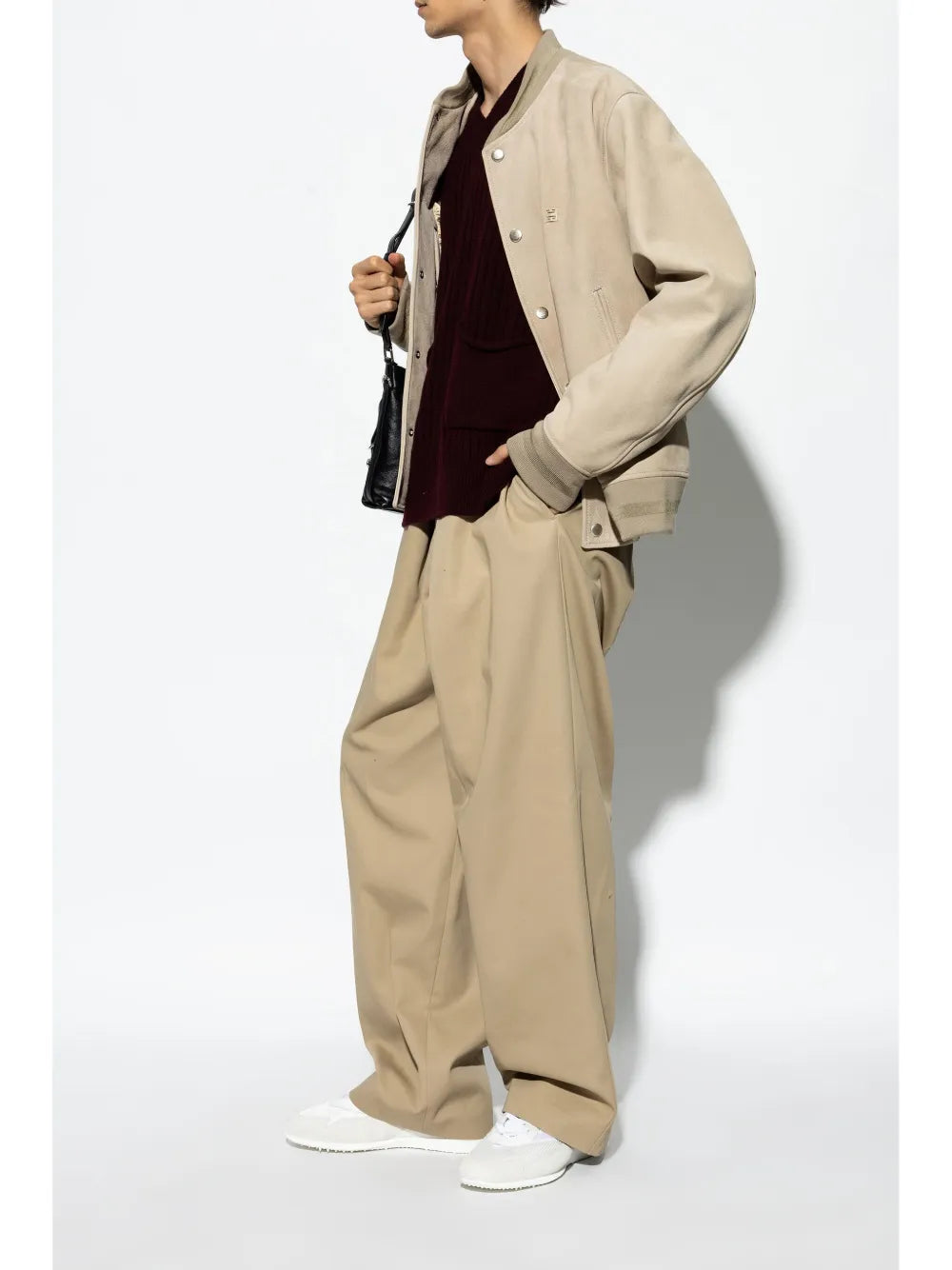 Givenchy white mesh-paneled sneakers on model, lace-up low-top style