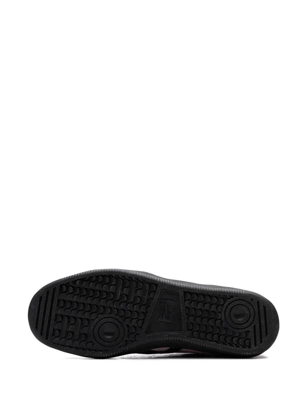 Black rubber outsole with textured tread pattern for traction