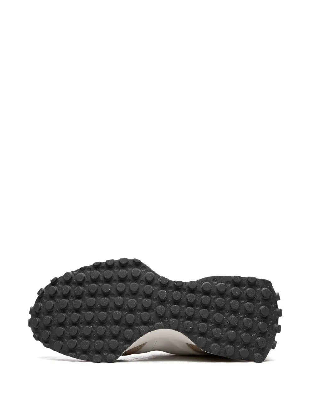 New Balance 327 outsole view with dark tread pattern under the sneaker