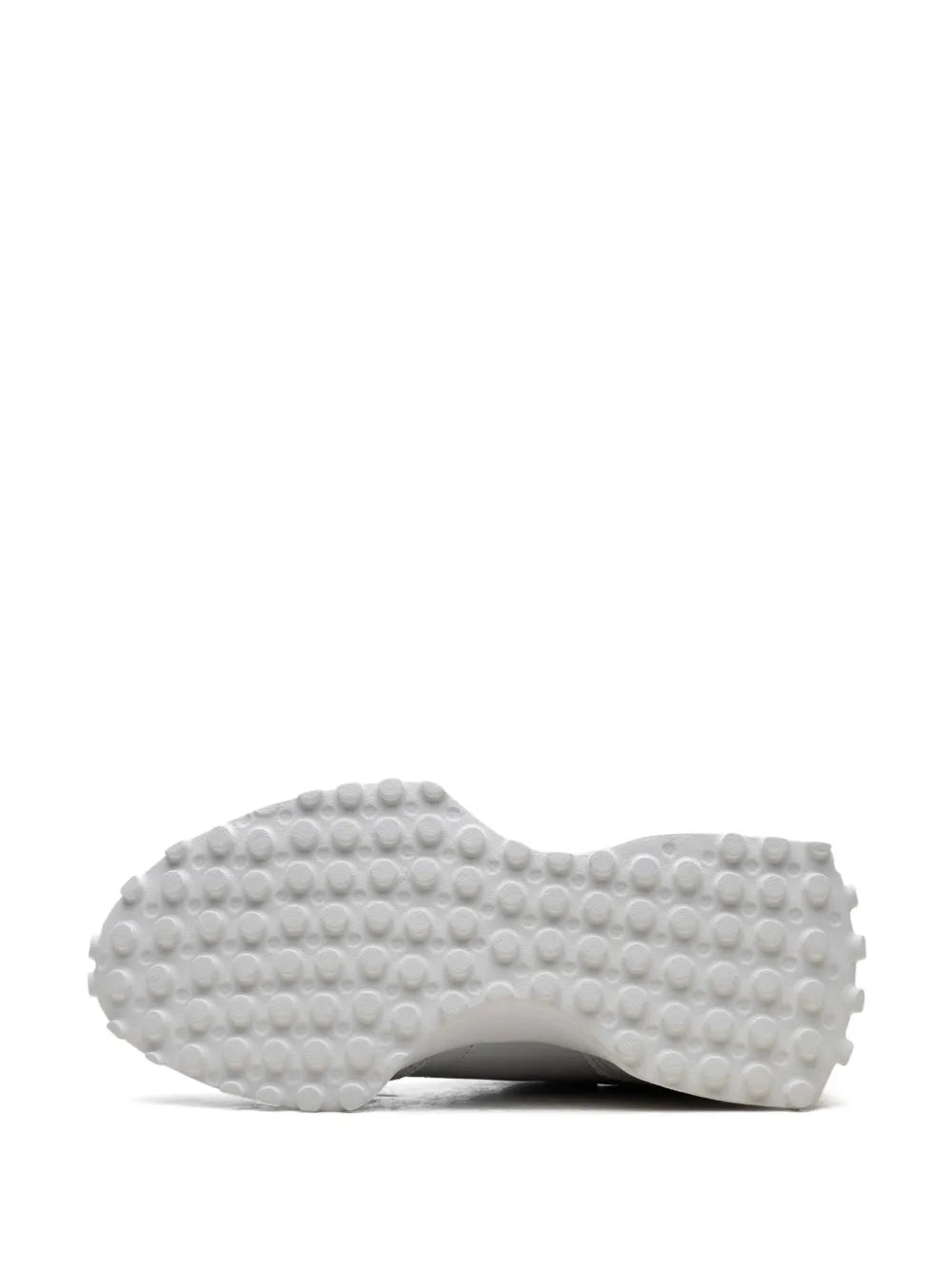 Grey sneaker outsole with circular tread pods