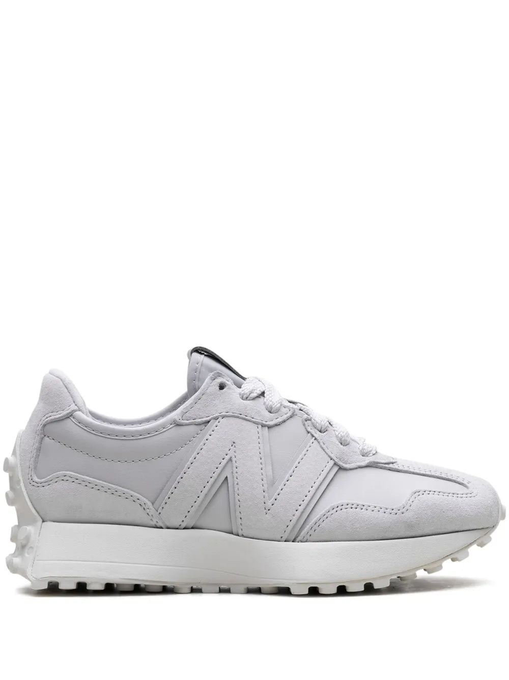 Grey low-top sneakers with lace-up front and N logo on side