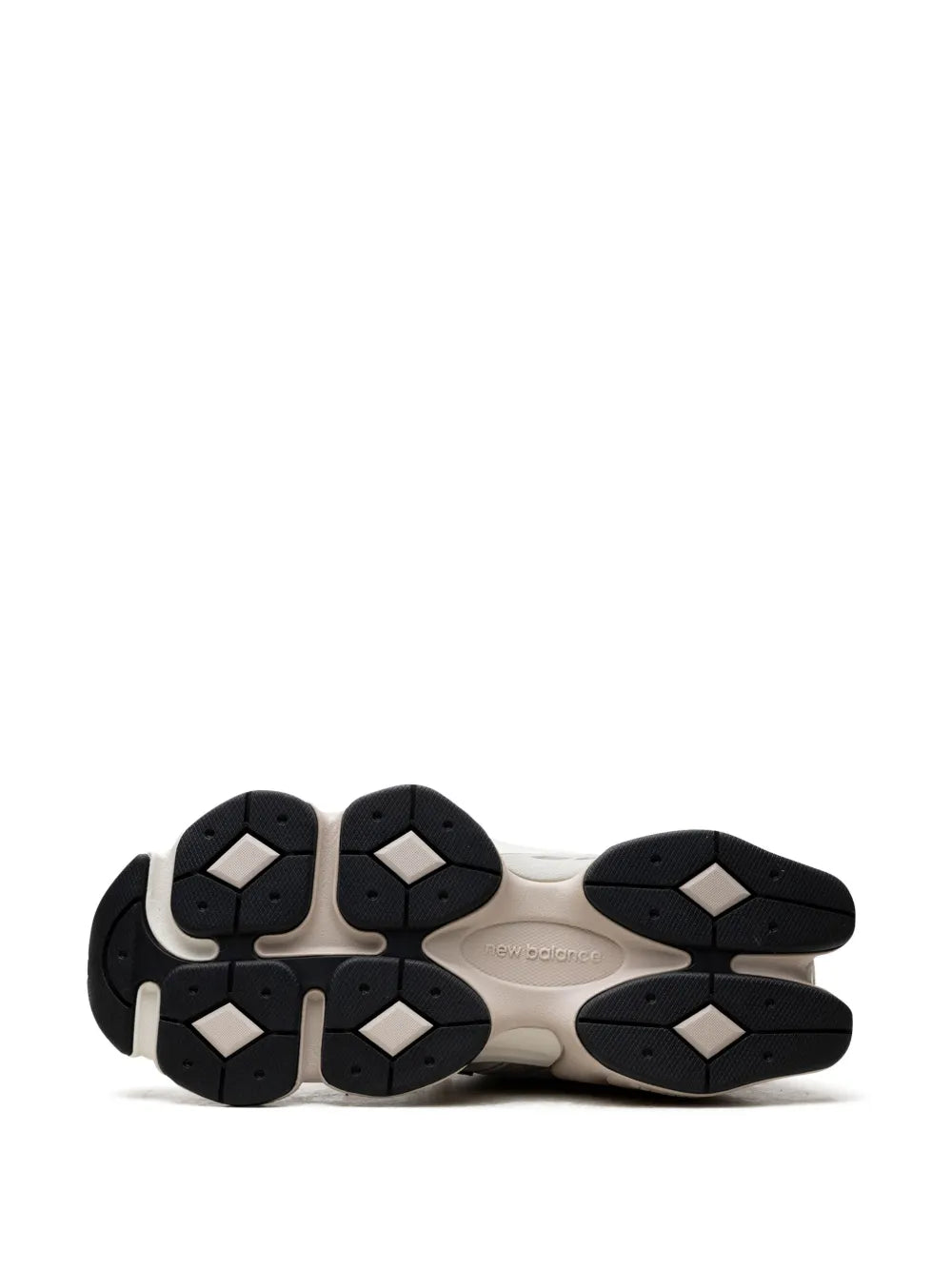 Black rubber sneaker outsole with hex and circular tread pattern