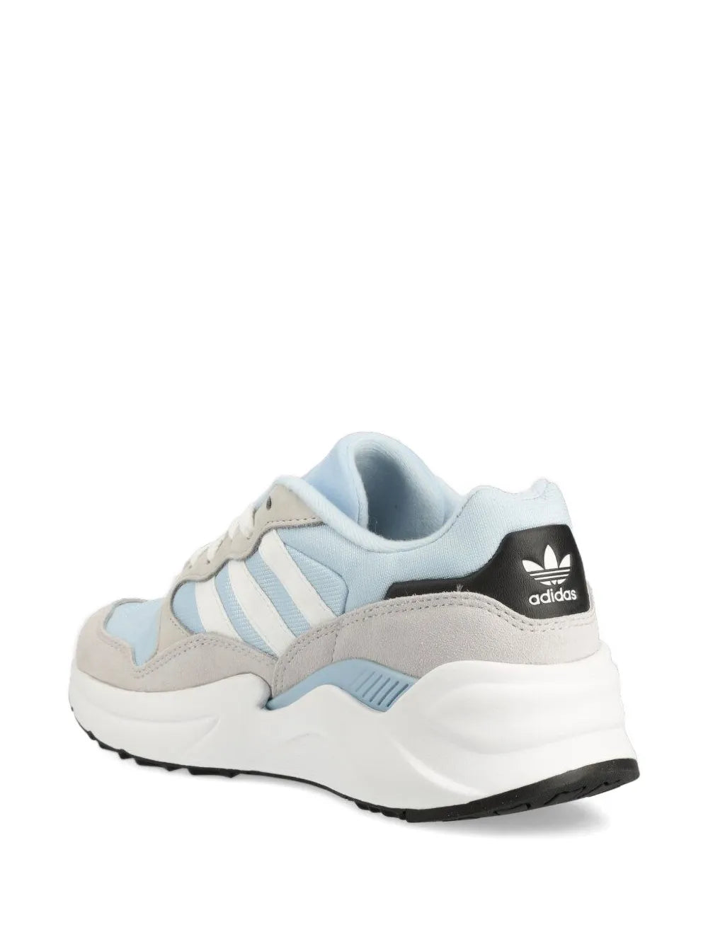Light blue and beige lace-up sneakers with adidas logo on the heel and white midsole