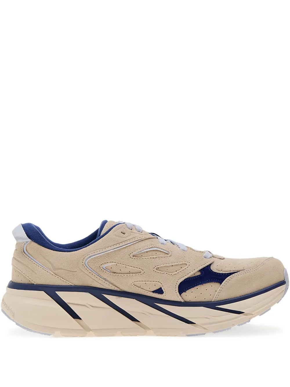 Beige suede running shoe with navy accents, lace-up front and cushioned sole.