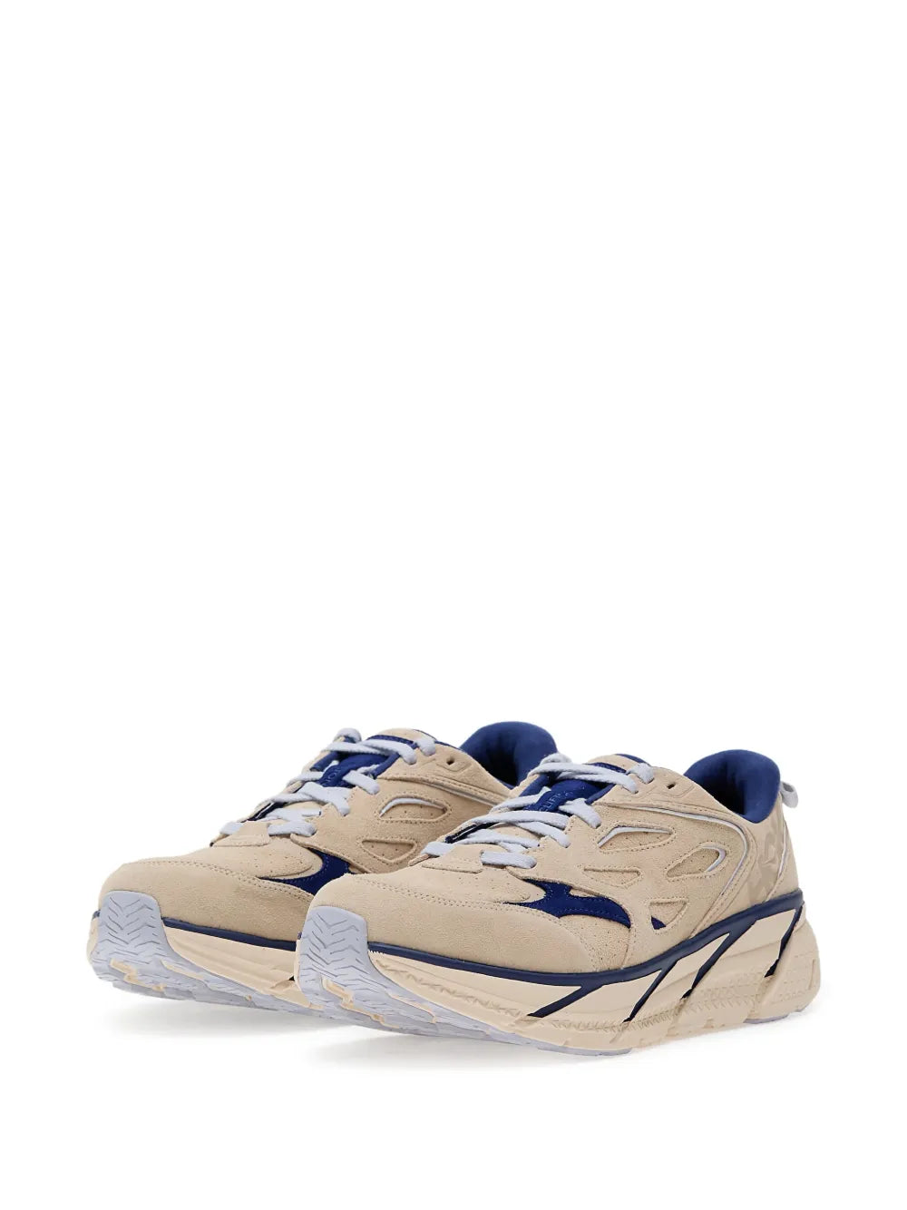 Beige suede lace-up running shoes with navy trim and thick white midsole.