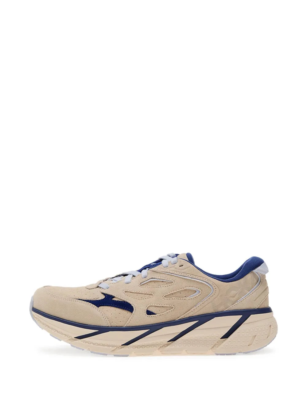 Beige suede running shoe with navy stripe detailing and cream midsole cushioning.