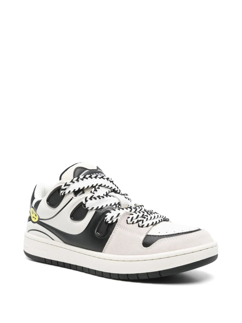 Black and white low-top sneaker with side panels and lace-up front, chunky sole