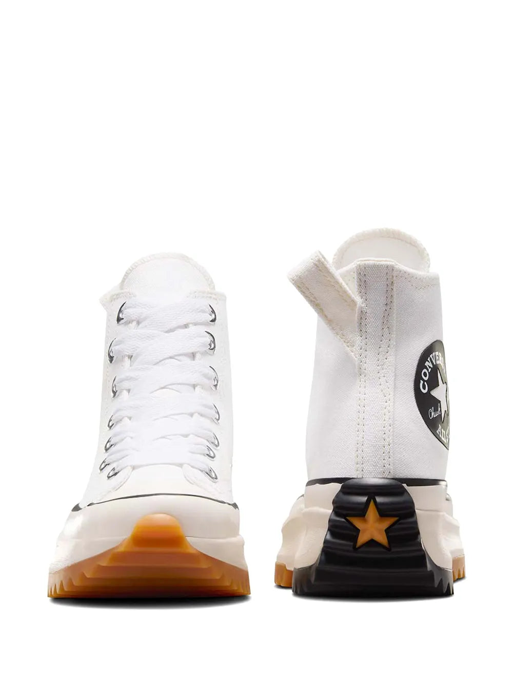 White Converse high-top sneakers with star logo and thick black-and-orange sole