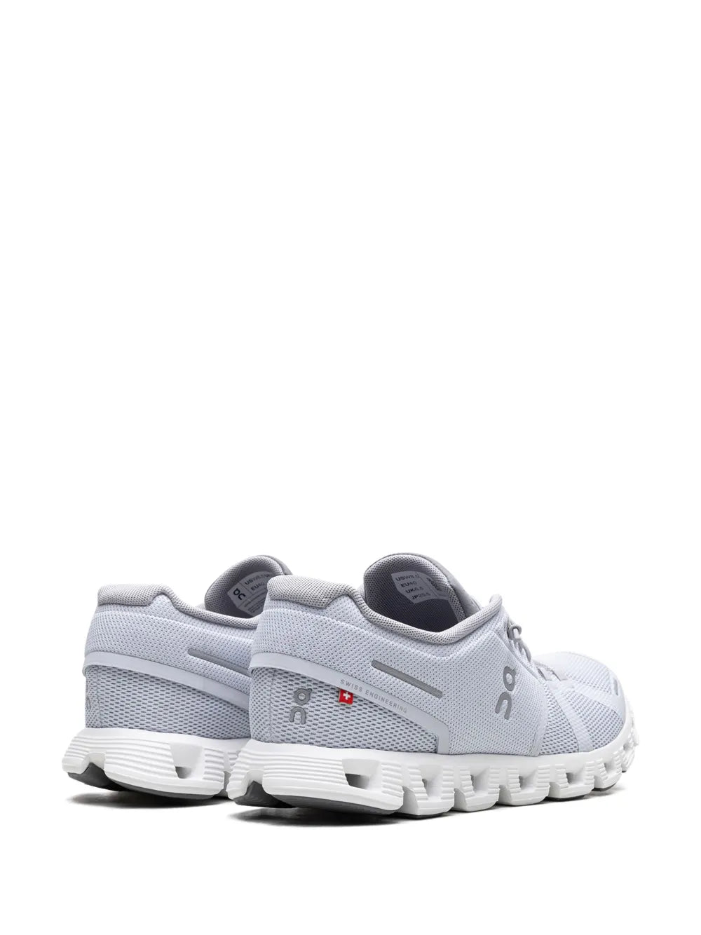 Light grey running shoe heel view with padded collar and cushioned outsole pods
