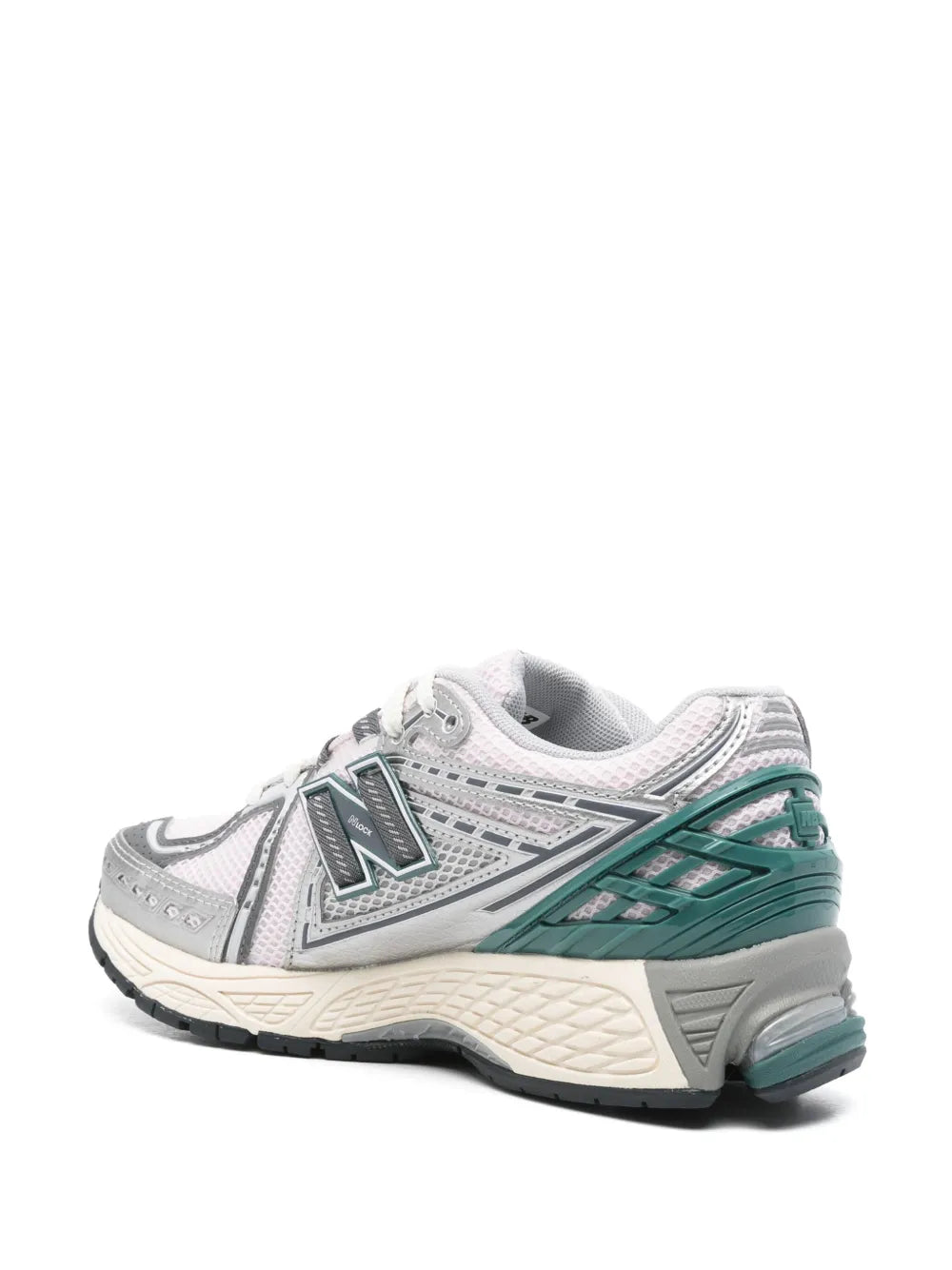 White and gray sneaker side view with teal/green stripe detail and textured midsole
