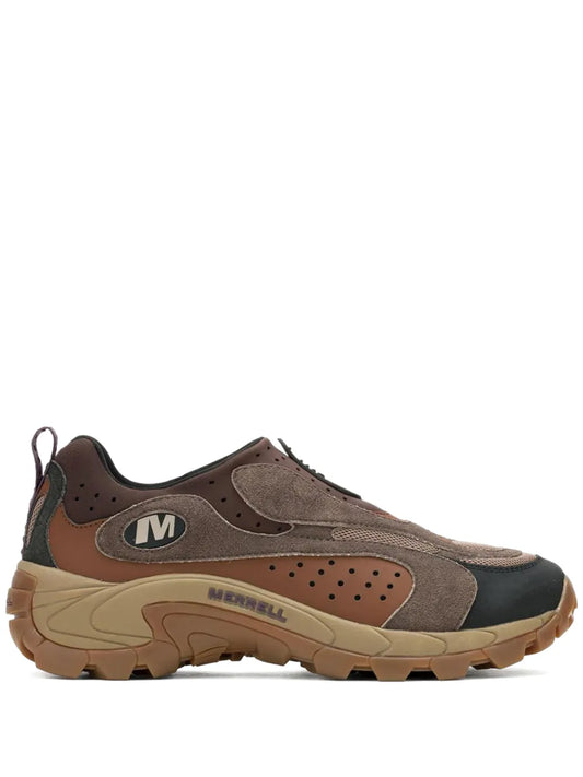 Brown moc-style slip-on sneakers with suede panels and chunky rubber tread.