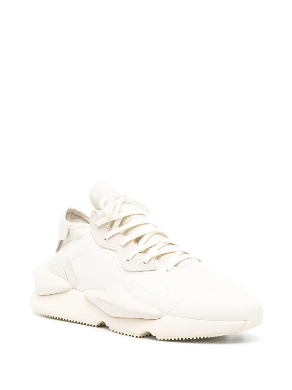 White low-top sneaker, side view, lace-up with thick sole and heel tab