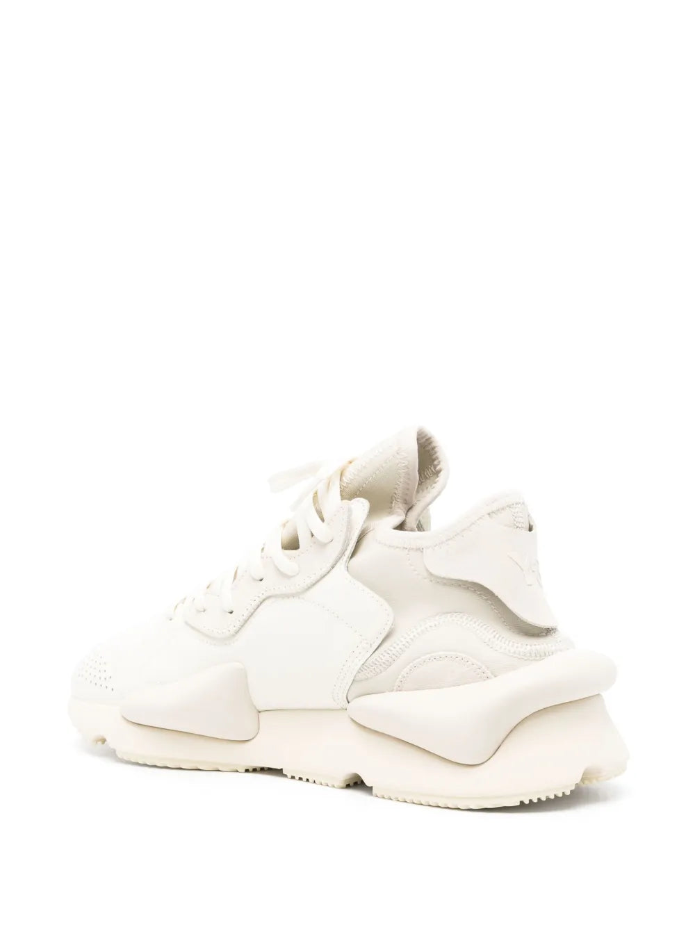 White lace-up sneaker with textured overlays and chunky rubber sole