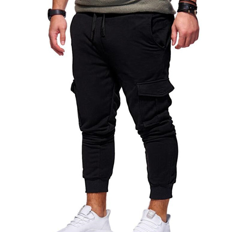 Men’s cargo sweatpants in black, drawstring waistband, cargo pockets, cuffed jogger cuffs.