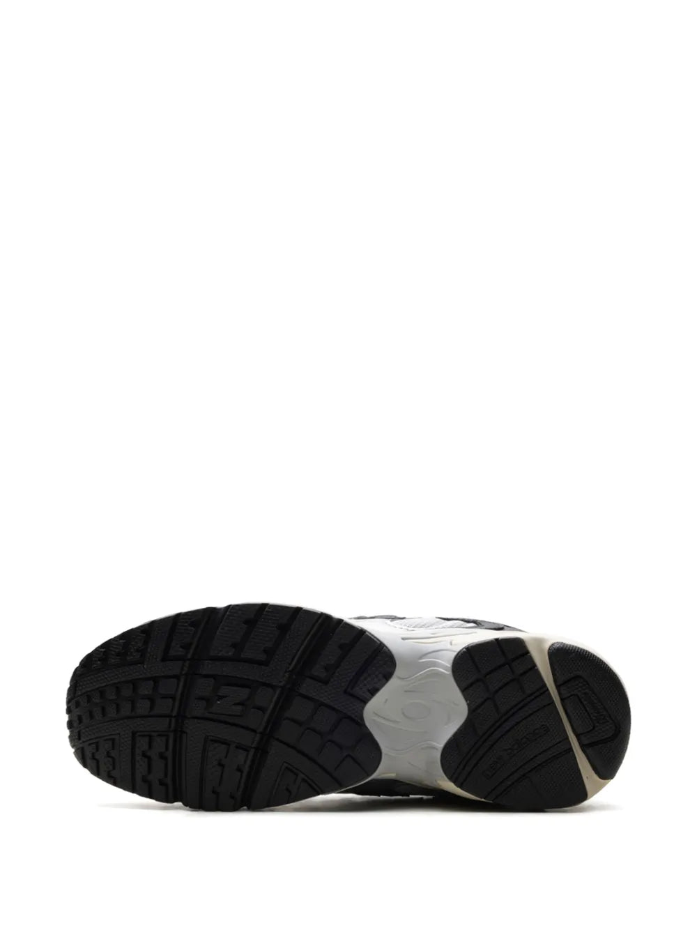 New Balance 725V1 sneaker outsole with black tread and beige heel section