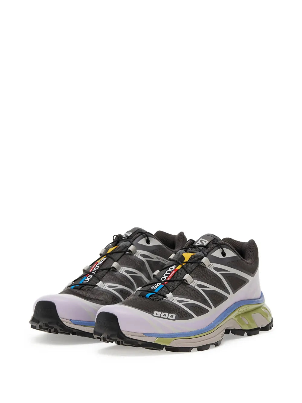 Trail running shoe with grey and black upper, white midsole, blue and green details
