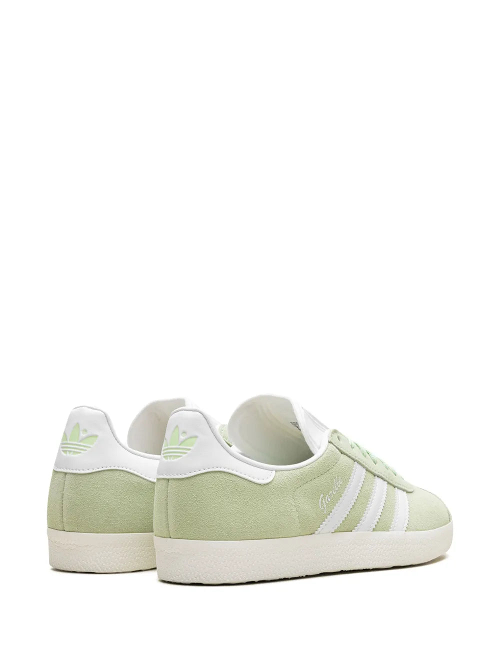 Low-top sneakers heel and side view, light green suede with white stripes