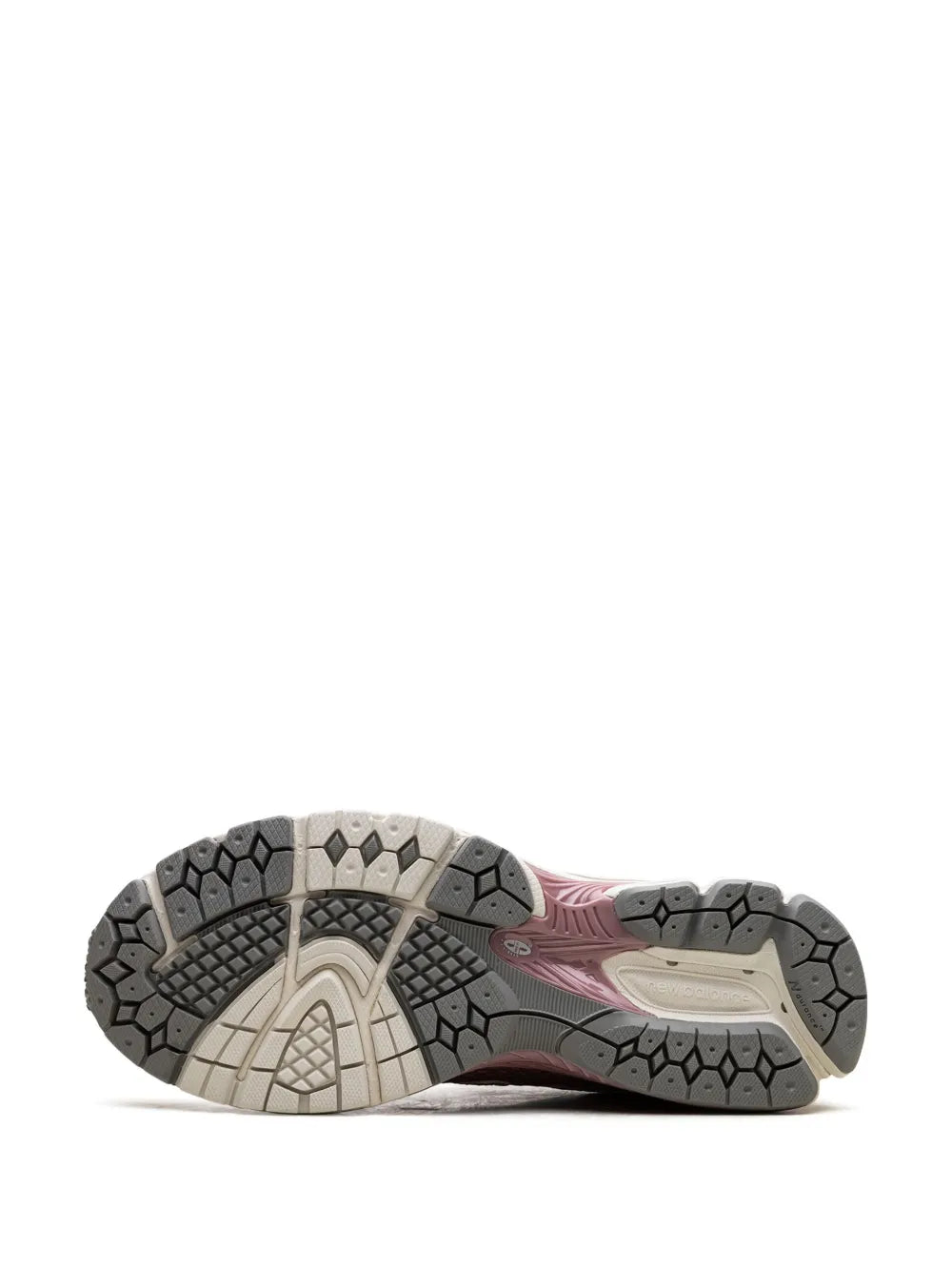 Outsole view of light gray running shoe with dark traction lugs and pink midsole
