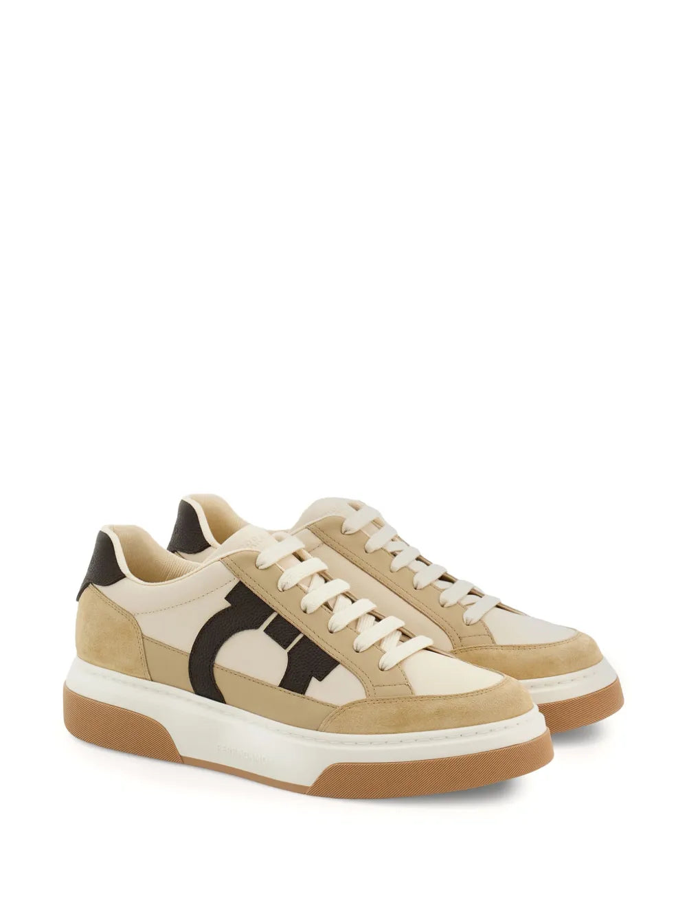 Beige Ferragamo Gancini sneakers with black swoosh panel and light brown rubber sole