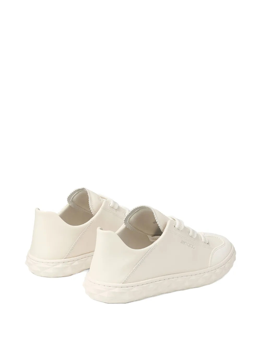 White lace-up low-top sneakers, side view, with padded collars and rubber sole