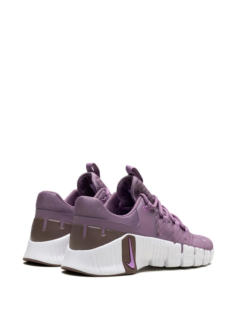 Pair of purple Nike sneakers showing side profile with Swoosh and white sole