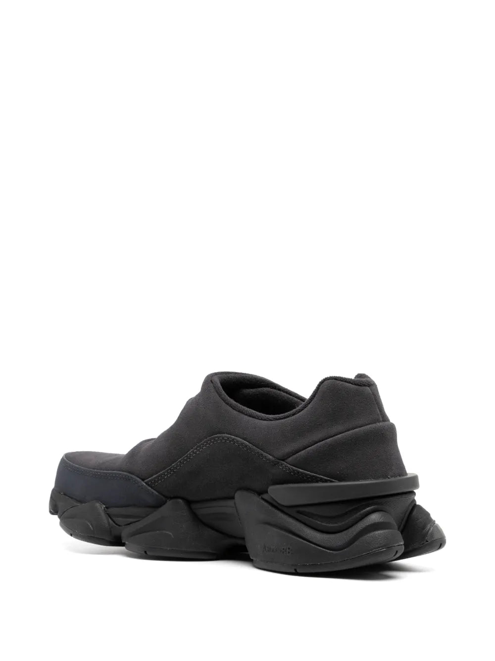 Black low-top sneaker showing heel and rear tread detail