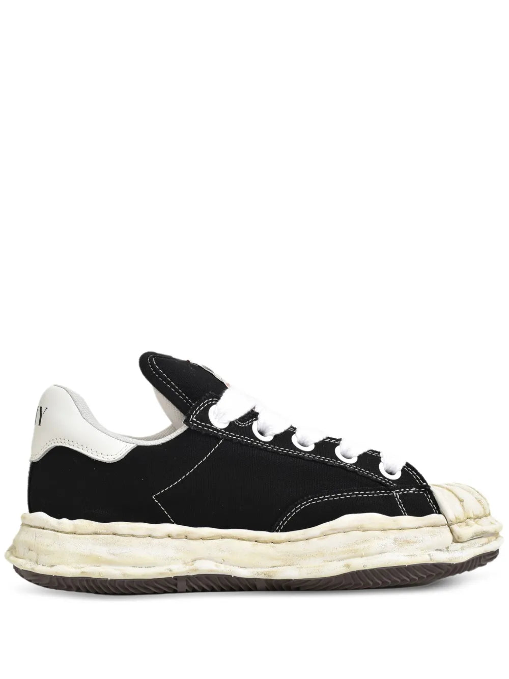Black low-top trainers with white laces and off-white textured sole