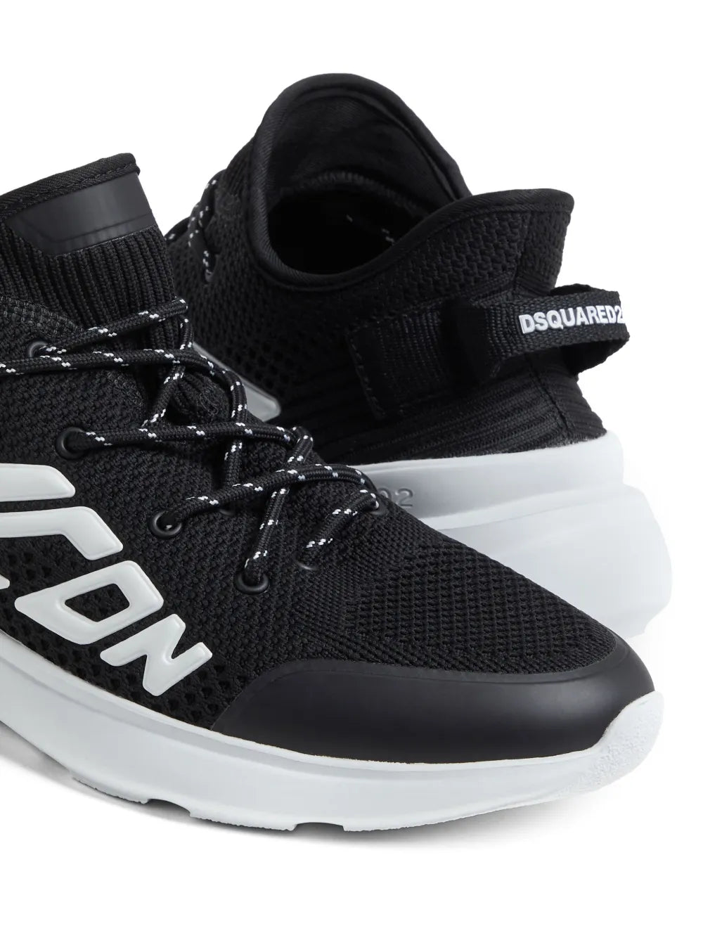 Black lace-up sneakers with Dsquared2 embossed logo patch and white side emblem
