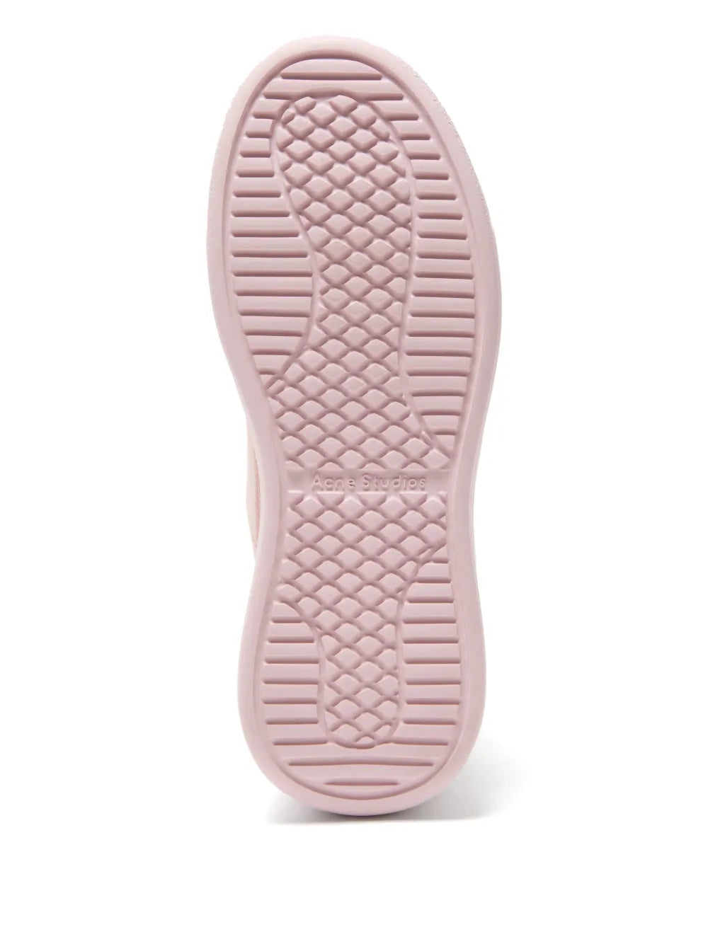 Pink platform sneaker outsole with textured tread pattern