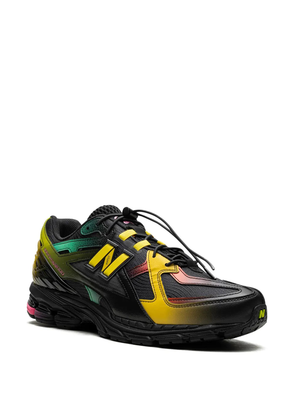 New Balance sneakers, black uppers with yellow N logo and green heel panel