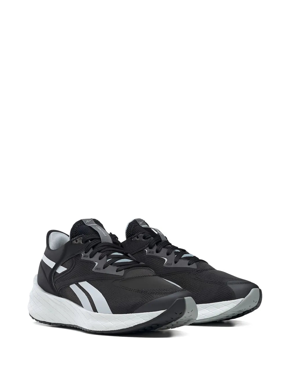 Reebok black running shoes, side view with white midsole and logo stripes