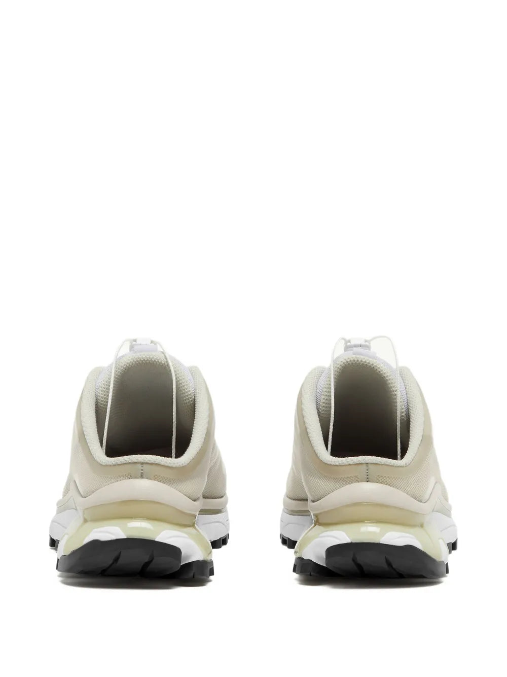 Light beige mule sneakers with cushioned heel and chunky black sole