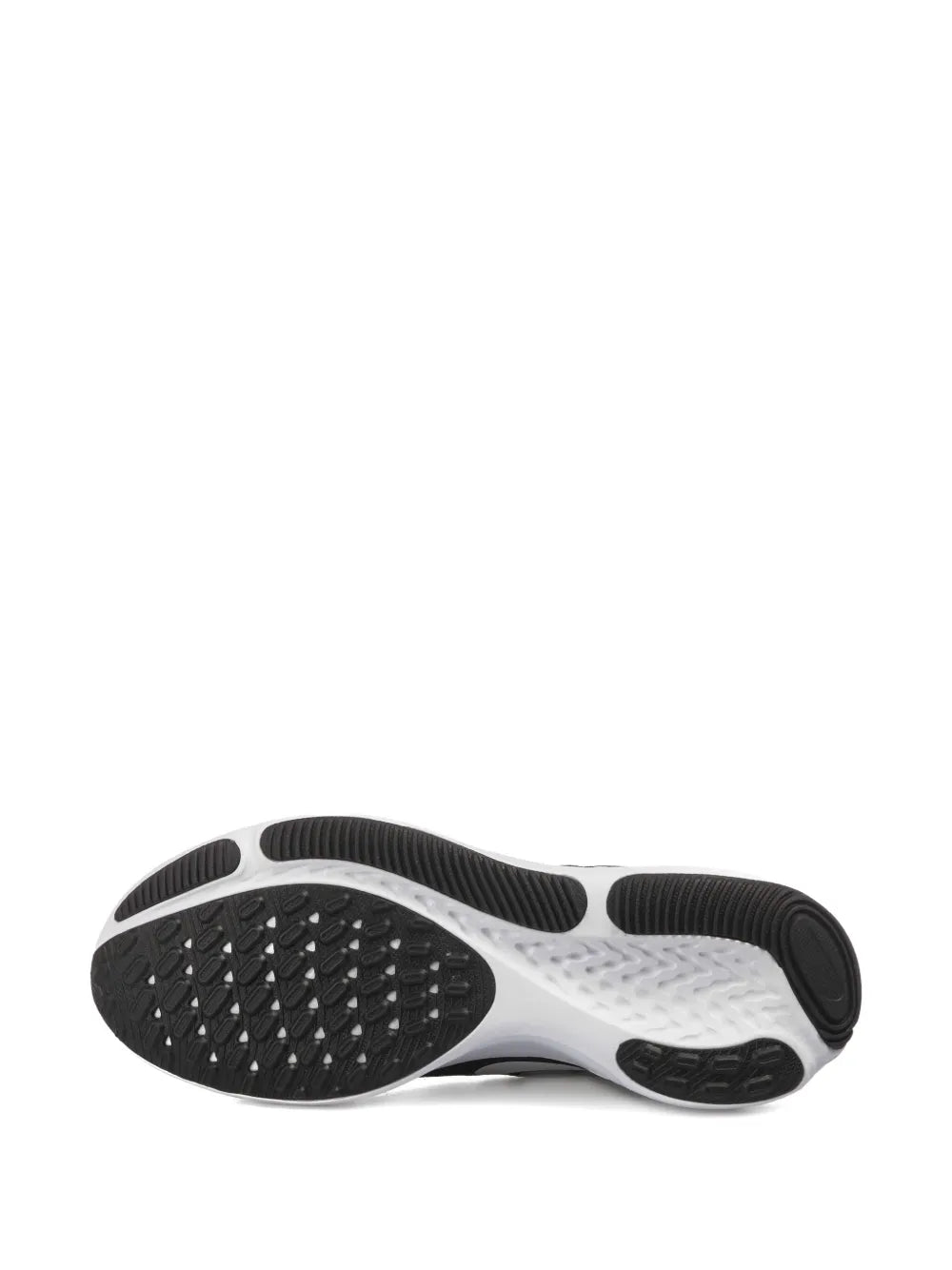Shoe outsole view with black tread pattern and white midsole portion.