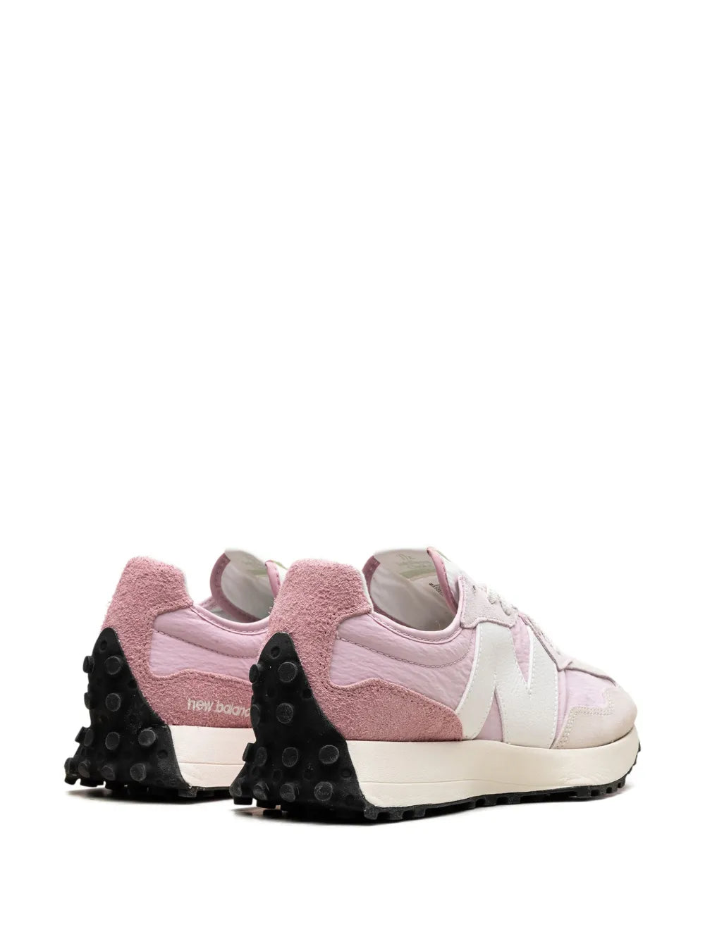 Pink and white low-top sneaker heel view, lace-up, textured pink panels, black outsole