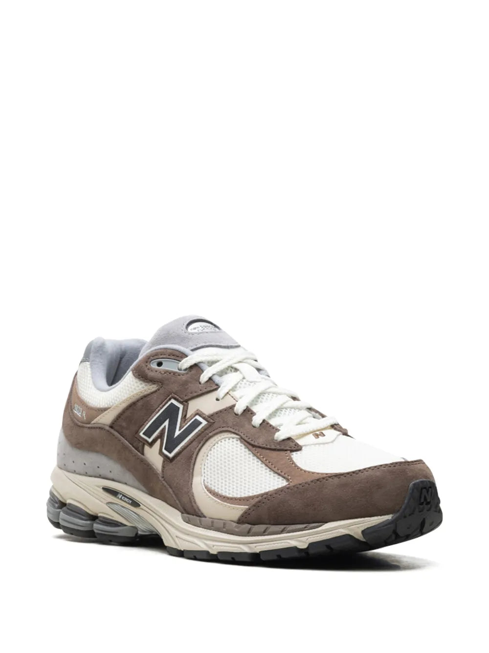 Suede sneakers in brown, off-white, and gray; side view with N logo
