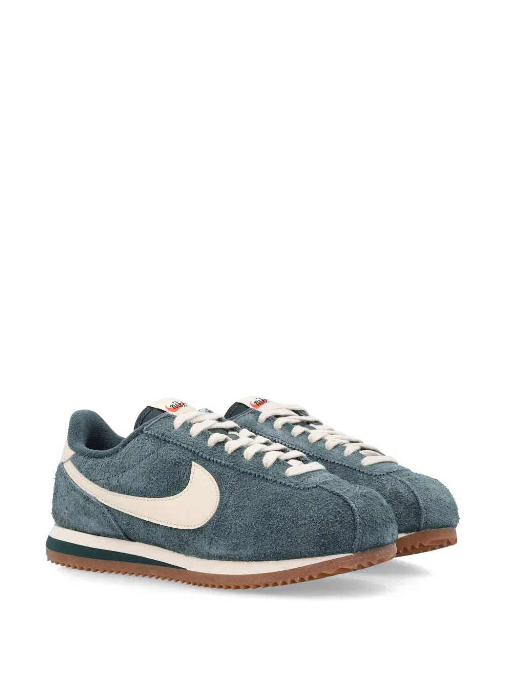 Cortez low sneakers, teal suede, white swoosh, lace-up front, gum sole
