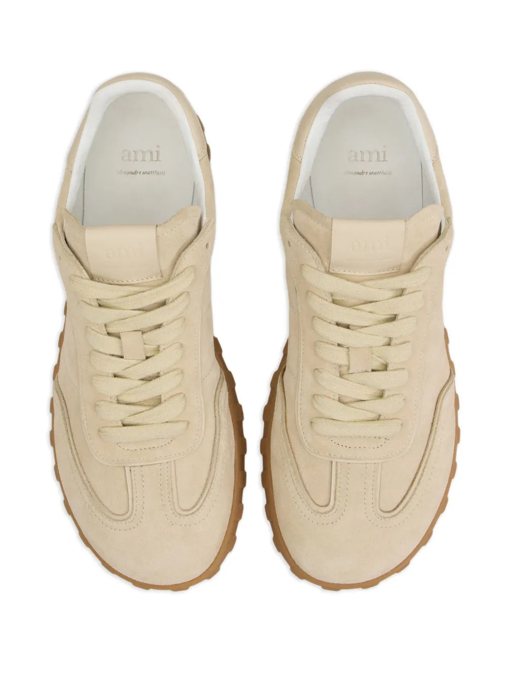 Light beige lace-up sneakers with branding on tongue and padded collar