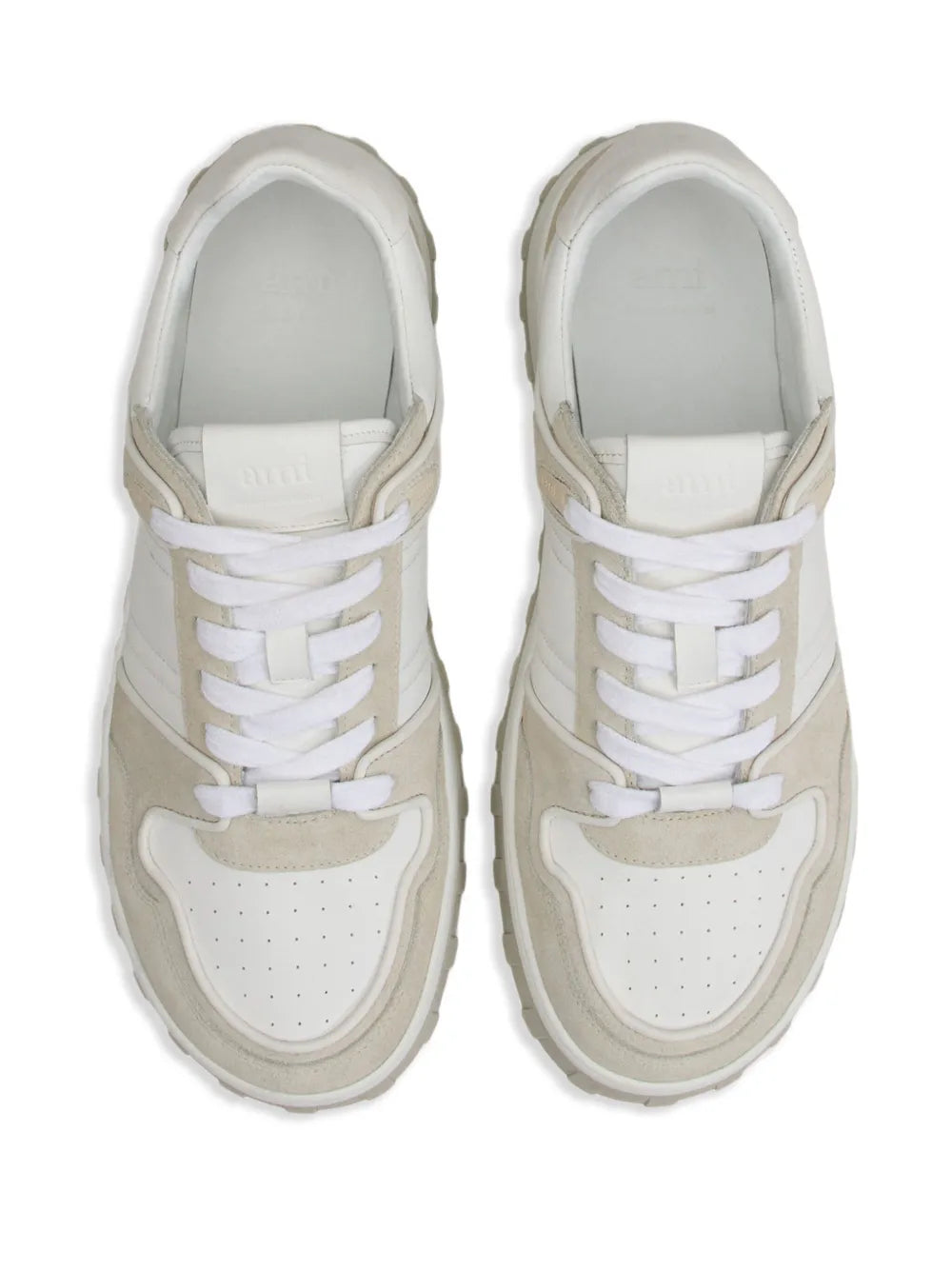 Pair of low-top sneakers, white laces and padded tongue, beige heel panels